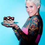 kate magic raw foodist holding a cake